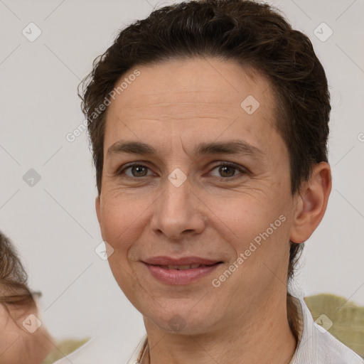 Joyful white adult female with short  brown hair and brown eyes