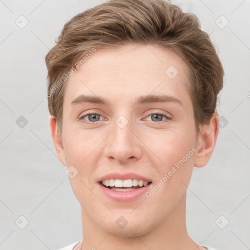 Joyful white young-adult female with short  brown hair and grey eyes