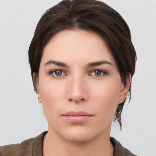 Neutral white young-adult female with short  brown hair and brown eyes