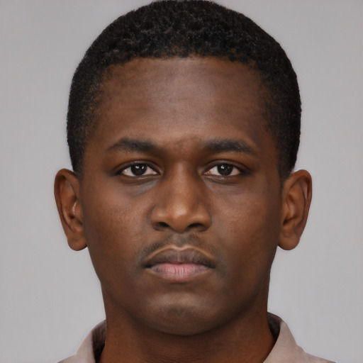 Neutral black young-adult male with short  brown hair and brown eyes