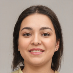 Joyful white young-adult female with medium  brown hair and brown eyes