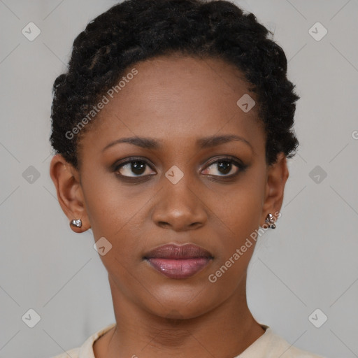 Joyful black young-adult female with short  black hair and brown eyes