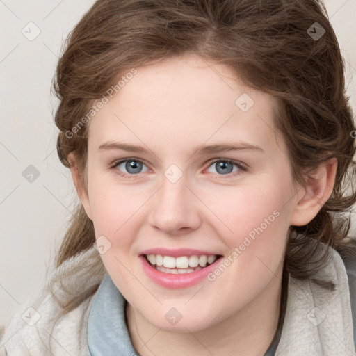 Joyful white young-adult female with medium  brown hair and blue eyes