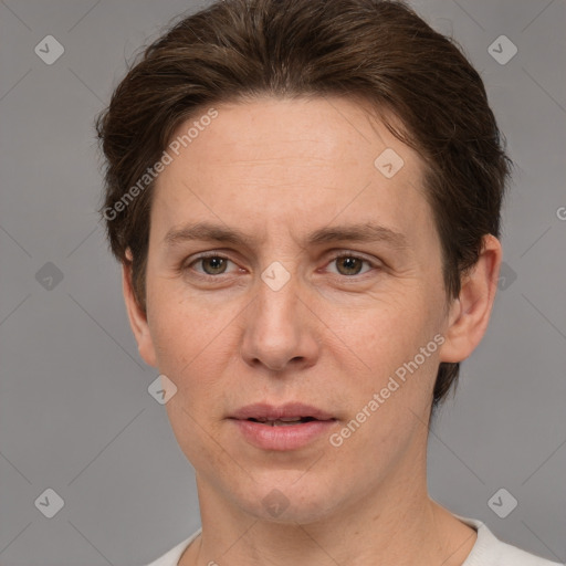 Joyful white adult female with short  brown hair and brown eyes