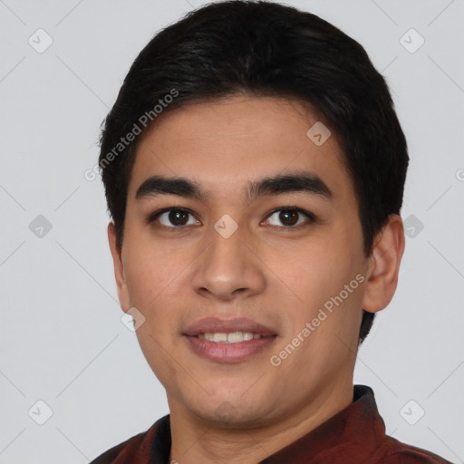 Joyful latino young-adult male with short  black hair and brown eyes