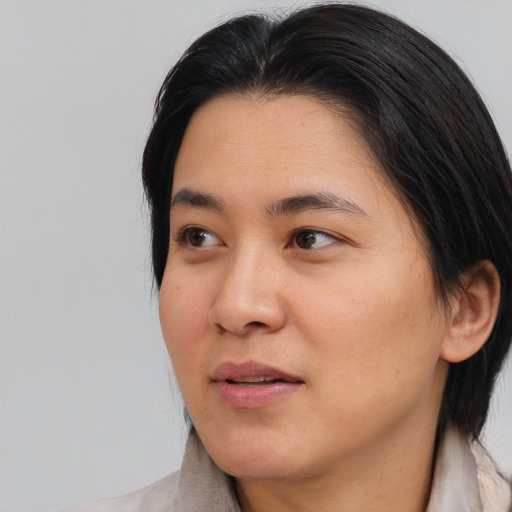 Neutral asian young-adult female with medium  brown hair and brown eyes