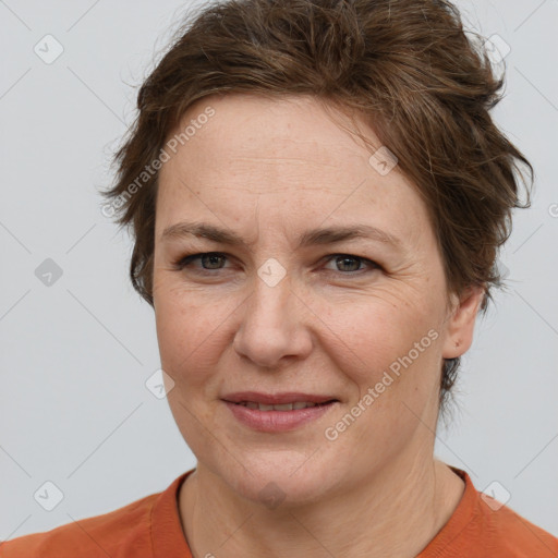 Joyful white adult female with short  brown hair and brown eyes