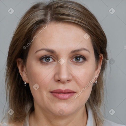 Joyful white adult female with medium  brown hair and brown eyes