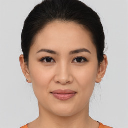 Joyful asian young-adult female with medium  brown hair and brown eyes