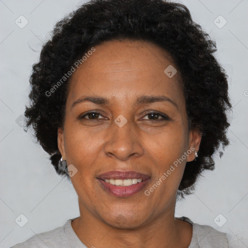 Joyful black adult female with short  brown hair and brown eyes