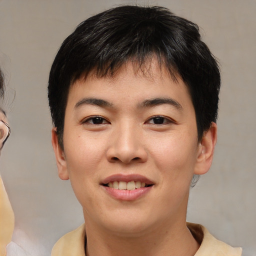 Joyful asian young-adult male with short  brown hair and brown eyes