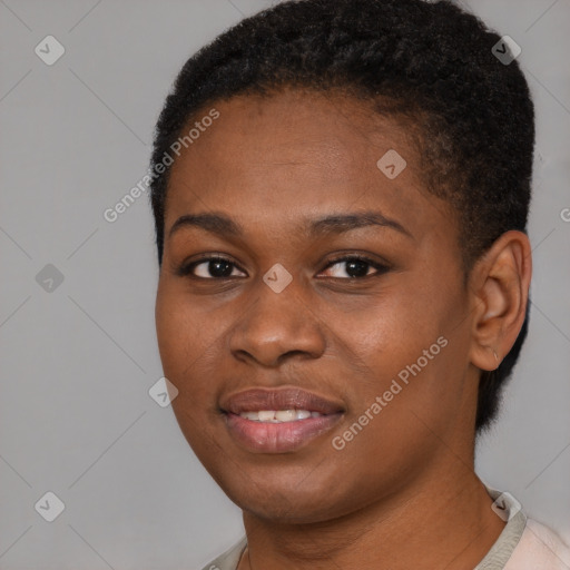 Joyful black young-adult female with short  brown hair and brown eyes