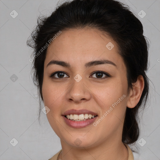 Joyful latino young-adult female with medium  brown hair and brown eyes