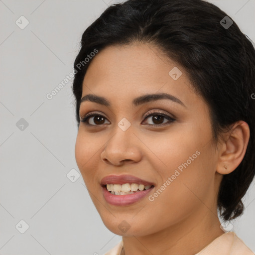 Joyful latino young-adult female with medium  brown hair and brown eyes