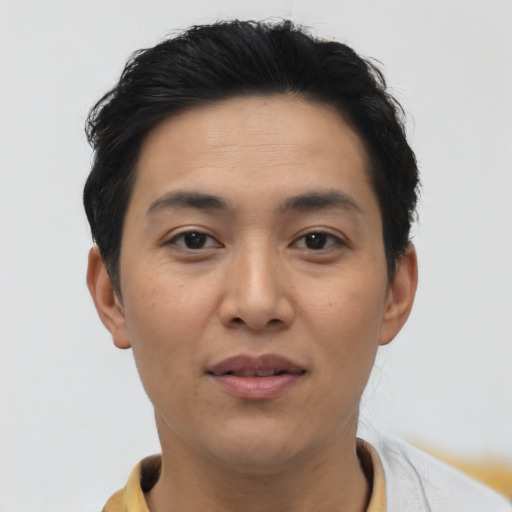 Joyful asian young-adult female with short  brown hair and brown eyes
