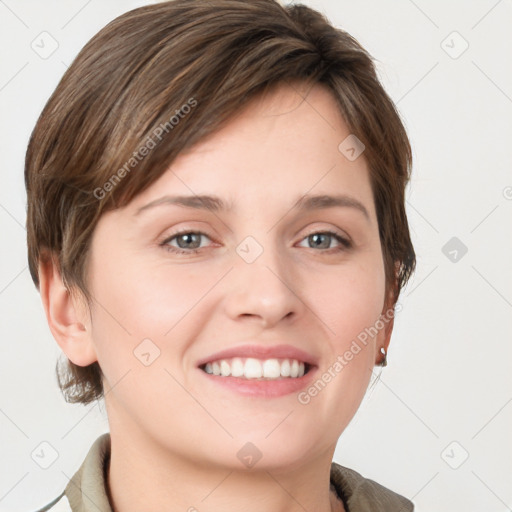 Joyful white young-adult female with short  brown hair and grey eyes