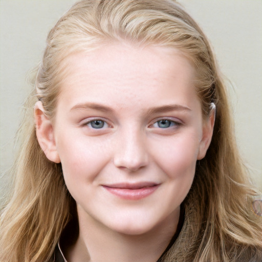 Joyful white young-adult female with long  brown hair and blue eyes