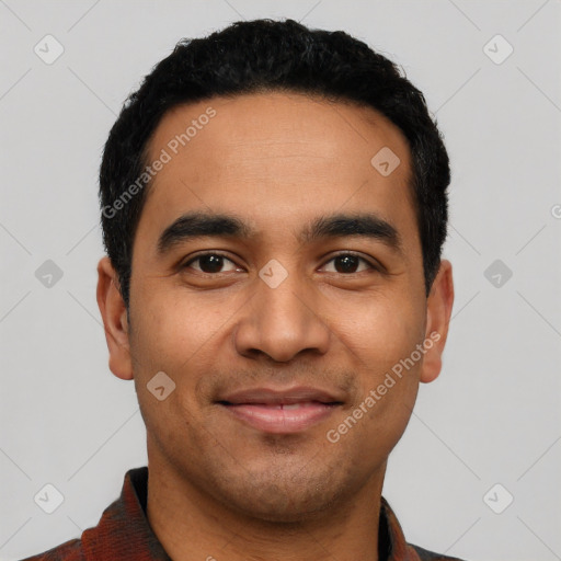 Joyful latino young-adult male with short  black hair and brown eyes