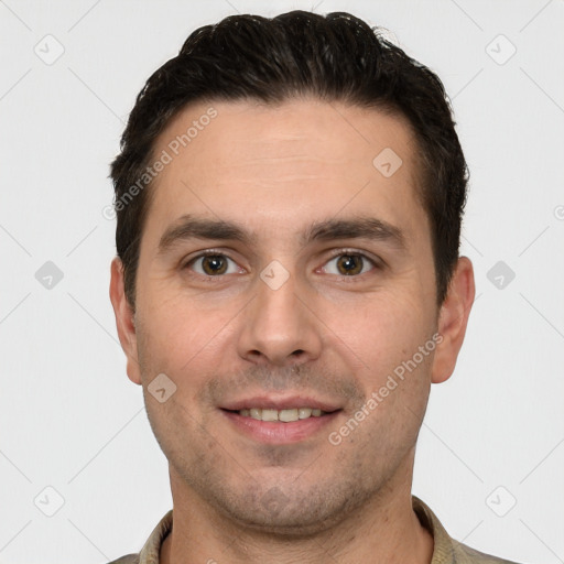 Joyful white young-adult male with short  brown hair and brown eyes