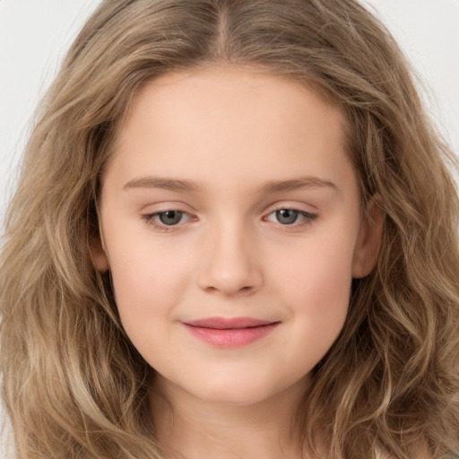 Joyful white child female with long  brown hair and brown eyes