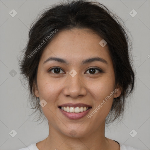 Joyful asian young-adult female with medium  brown hair and brown eyes