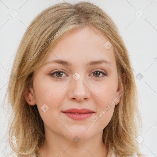 Joyful white young-adult female with medium  brown hair and blue eyes