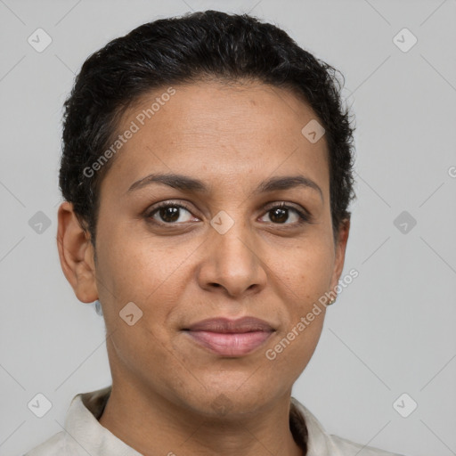 Joyful latino adult female with short  brown hair and brown eyes