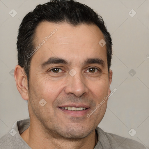 Joyful white adult male with short  black hair and brown eyes