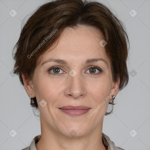 Joyful white adult female with medium  brown hair and grey eyes