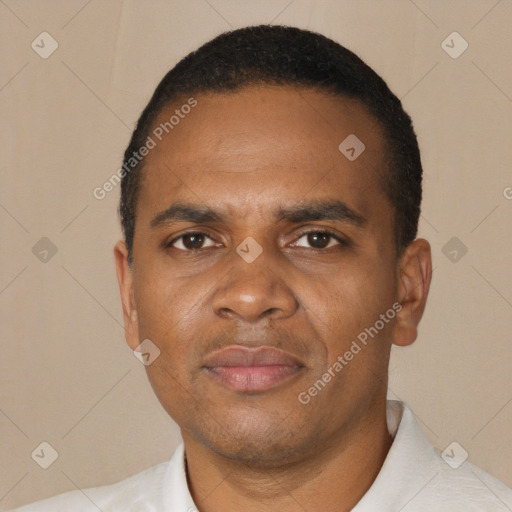 Joyful black adult male with short  black hair and brown eyes