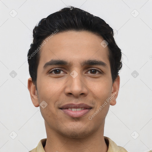 Joyful latino young-adult male with short  black hair and brown eyes