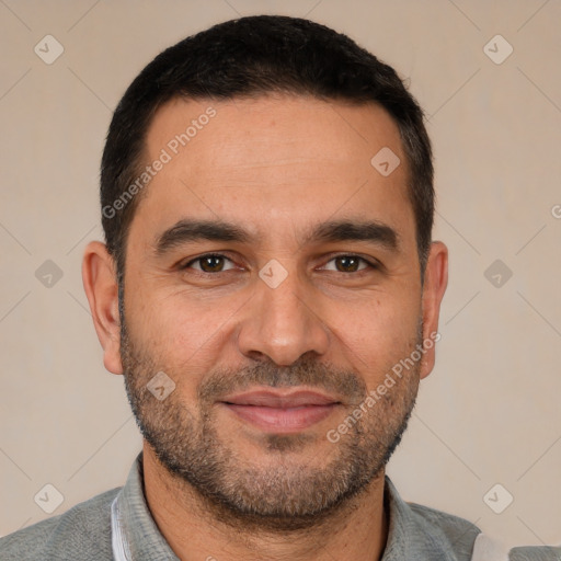 Joyful white adult male with short  black hair and brown eyes