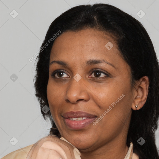 Joyful black adult female with medium  black hair and brown eyes