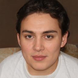 Joyful white young-adult male with medium  brown hair and brown eyes