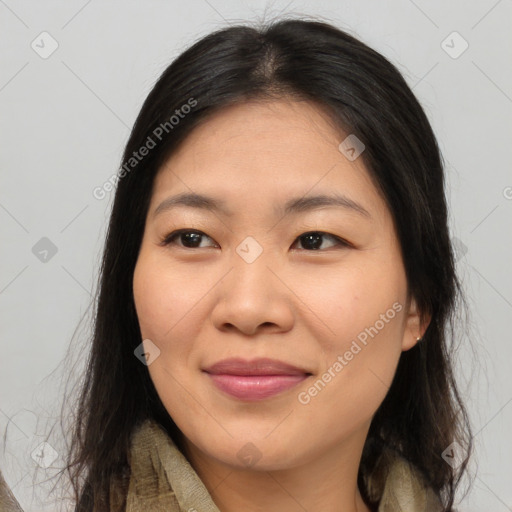 Joyful asian young-adult female with medium  brown hair and brown eyes