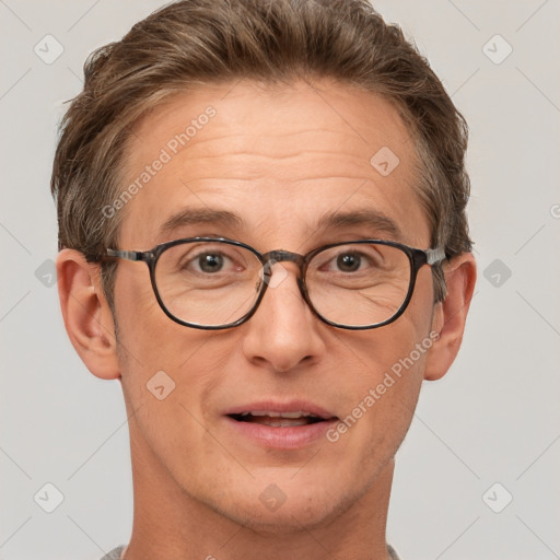 Joyful white adult male with short  brown hair and brown eyes