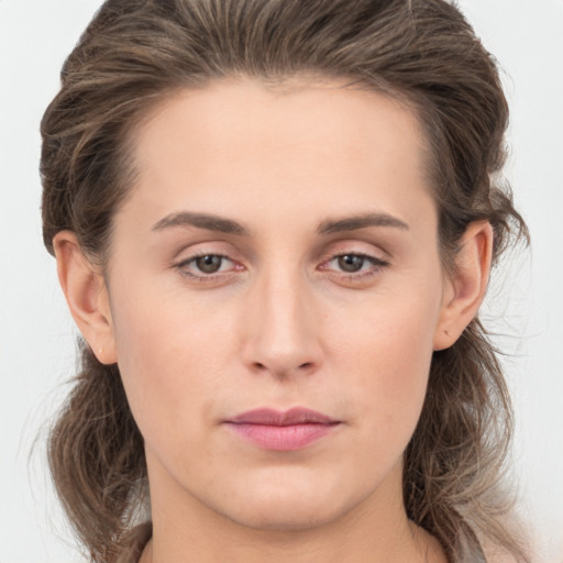 Neutral white young-adult female with long  brown hair and brown eyes