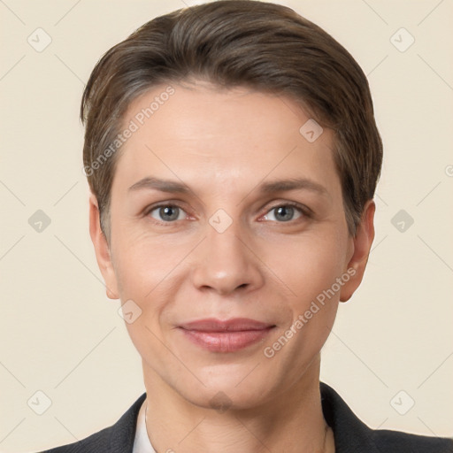 Joyful white adult female with short  brown hair and brown eyes