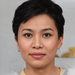 Joyful asian young-adult female with short  black hair and brown eyes