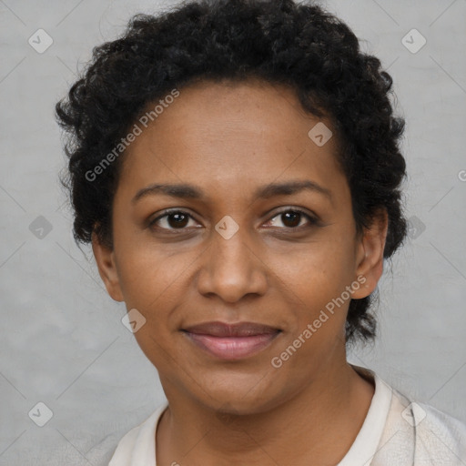 Joyful black adult female with short  brown hair and brown eyes