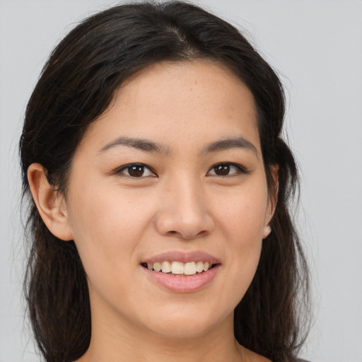 Joyful white young-adult female with medium  brown hair and brown eyes