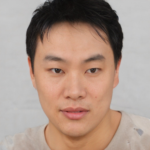 Neutral asian young-adult male with short  brown hair and brown eyes