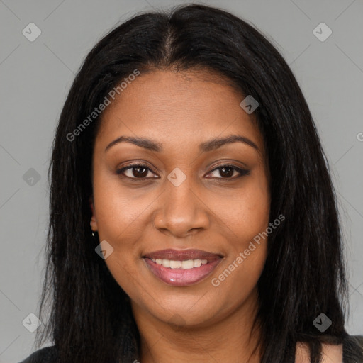 Joyful black young-adult female with long  brown hair and brown eyes