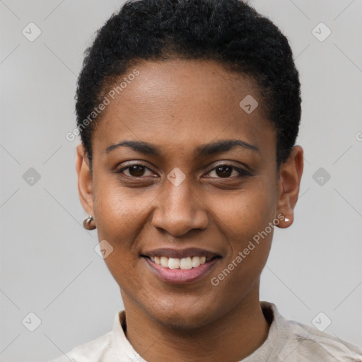 Joyful black young-adult female with short  black hair and brown eyes