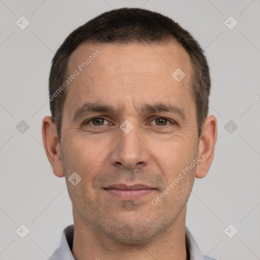 Joyful white adult male with short  brown hair and brown eyes