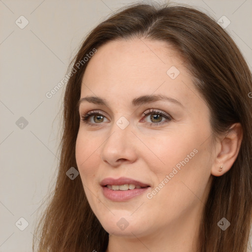 Joyful white adult female with long  brown hair and brown eyes