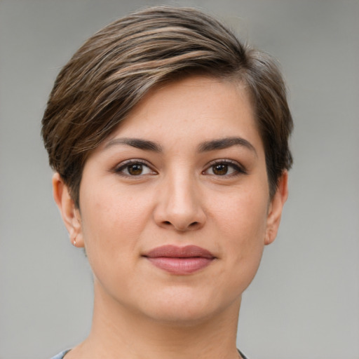 Joyful white young-adult female with short  brown hair and brown eyes