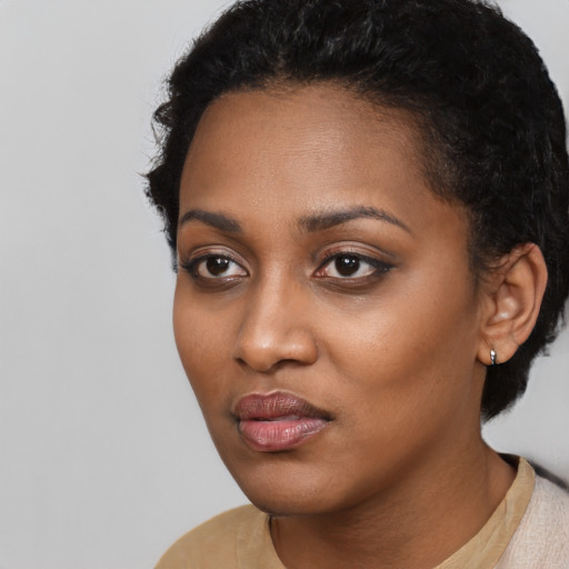 Neutral black young-adult female with short  black hair and brown eyes
