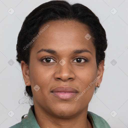 Joyful black young-adult female with short  brown hair and brown eyes