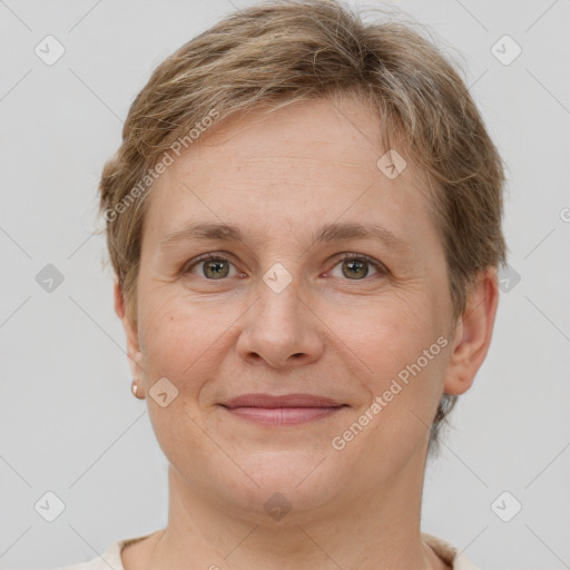 Joyful white adult female with short  brown hair and grey eyes